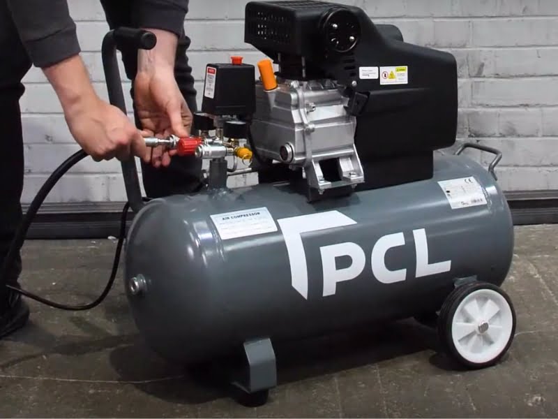 Grey PCL direct drive air compressor being used in a garage