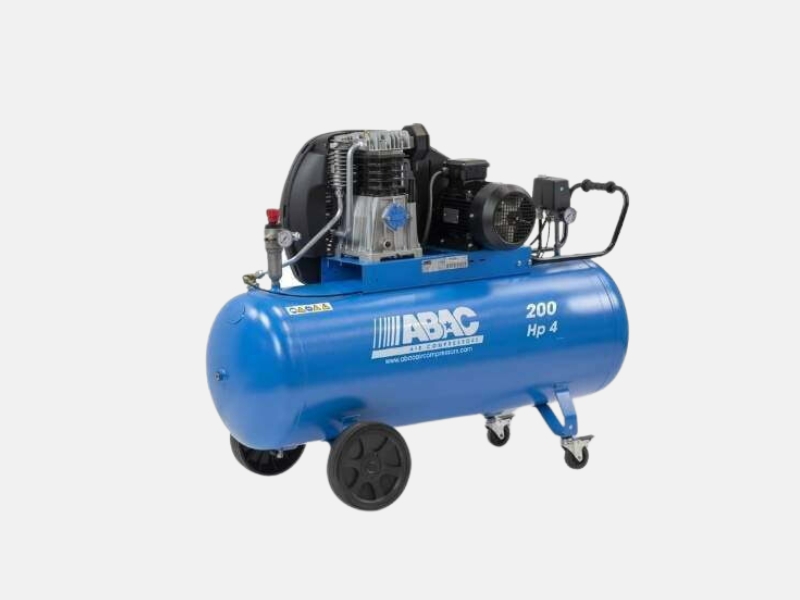 Product image of an Abac compressor with blue 200 litre tank, 2 wheels at the front and belt drive mounted on top of the tank.