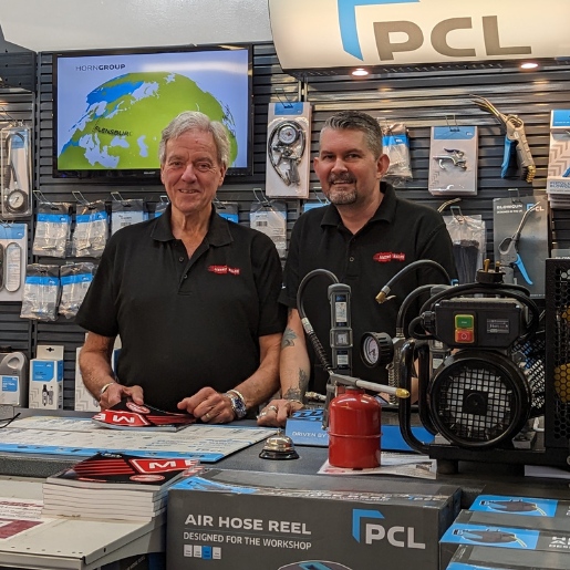 Metro Sales owner Gary Crotty stands behind the counter with Neil in our air compressor shop based in West Byfleet, Surrey.